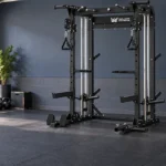 Full power rack with a barbell, bench, and neatly stored plates in a home garage gym