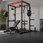 Budget power cage with a barbell and bench in an organized home garage gym